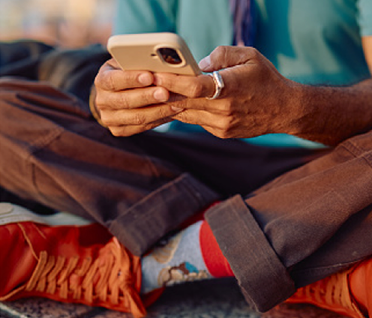 Close up photo of someone holding a smartphone, as they easily navigate the BNC mobile app.