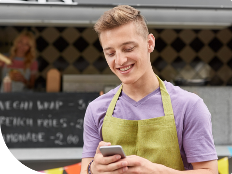 young worker logging into bank account to order checks