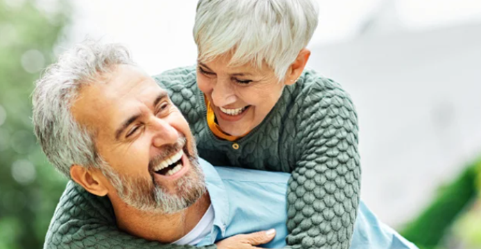 older woman on the shoulders of a older gentleman