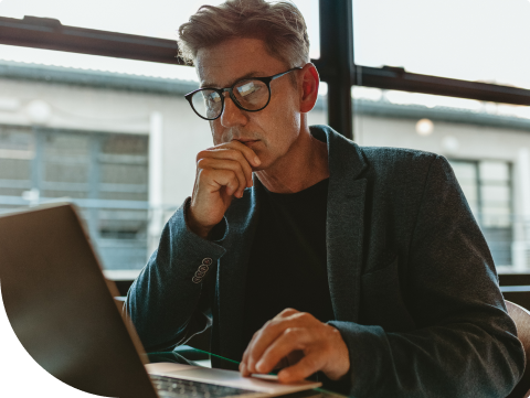 businessman looking at online banking while waiting at airport