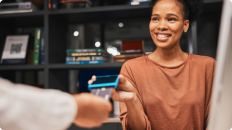 woman accepting card payment at a business