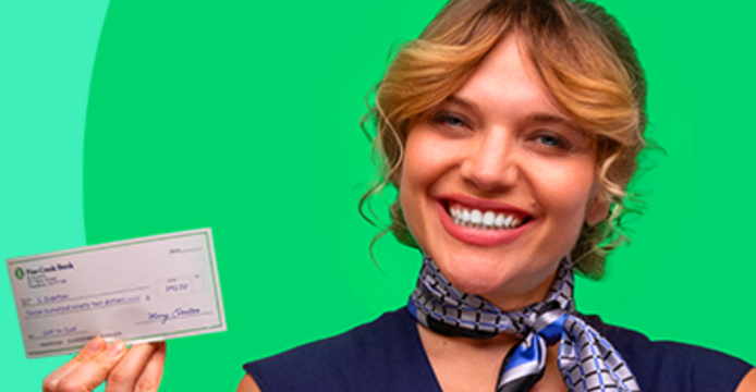 young woman holding physical bank account check