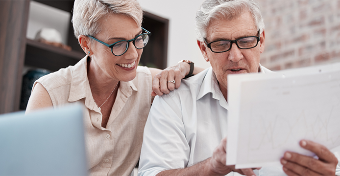 older couple looking at banking statement planning for retirement