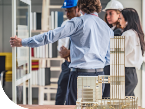 construction engineers looking at a model