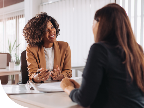 woman talking with banker about personal loan options