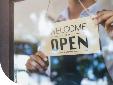 store with sign that says welcome we are open