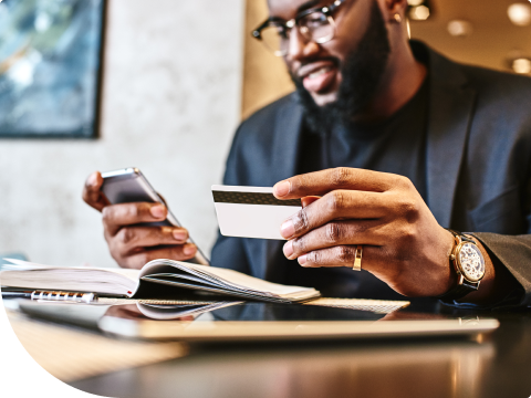 person entering card number on phone