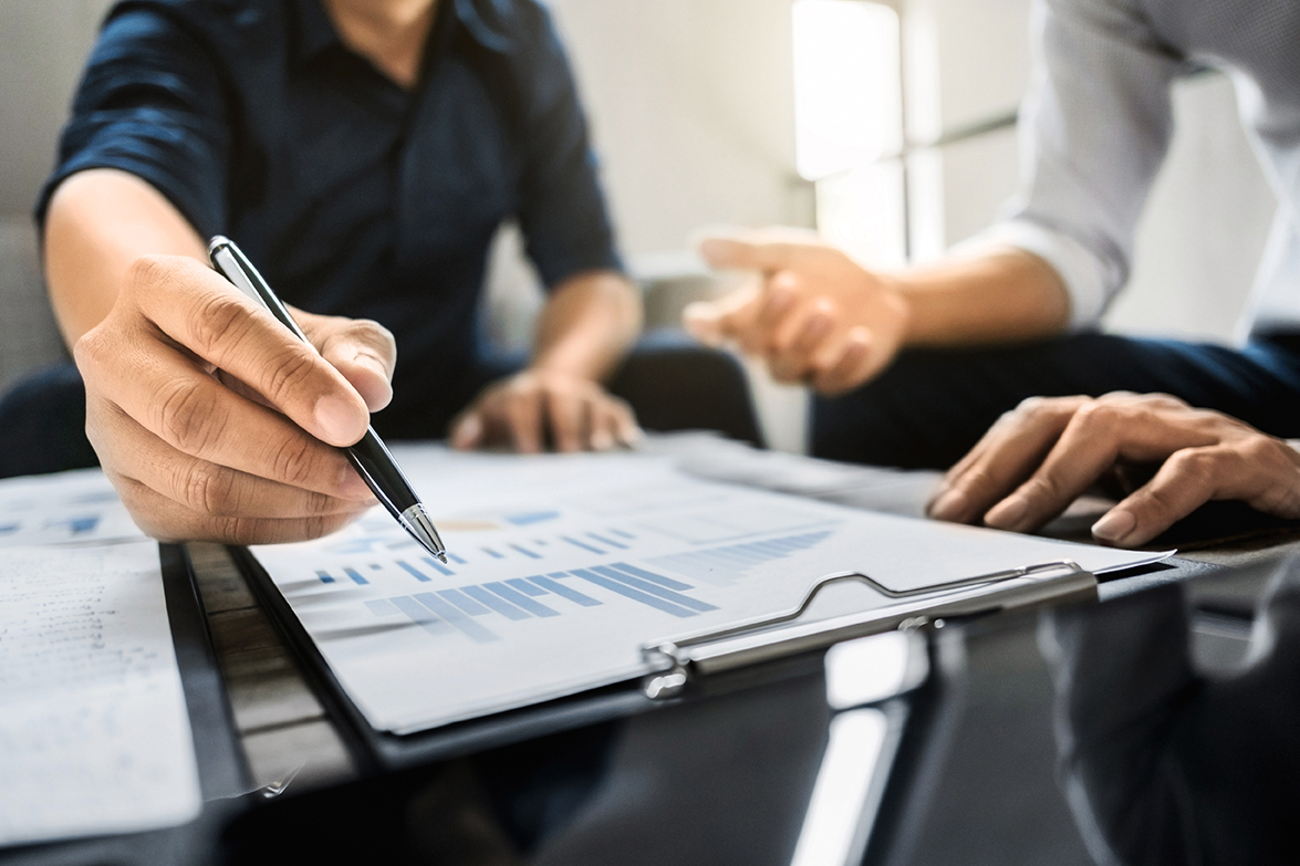Cloe up of a pair looking over investment portfolio